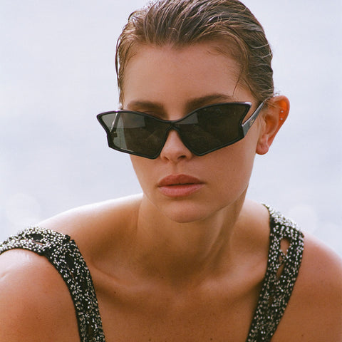 Le Specs Tailfin Black Female Wrap Sunglasses | Eyewear Index