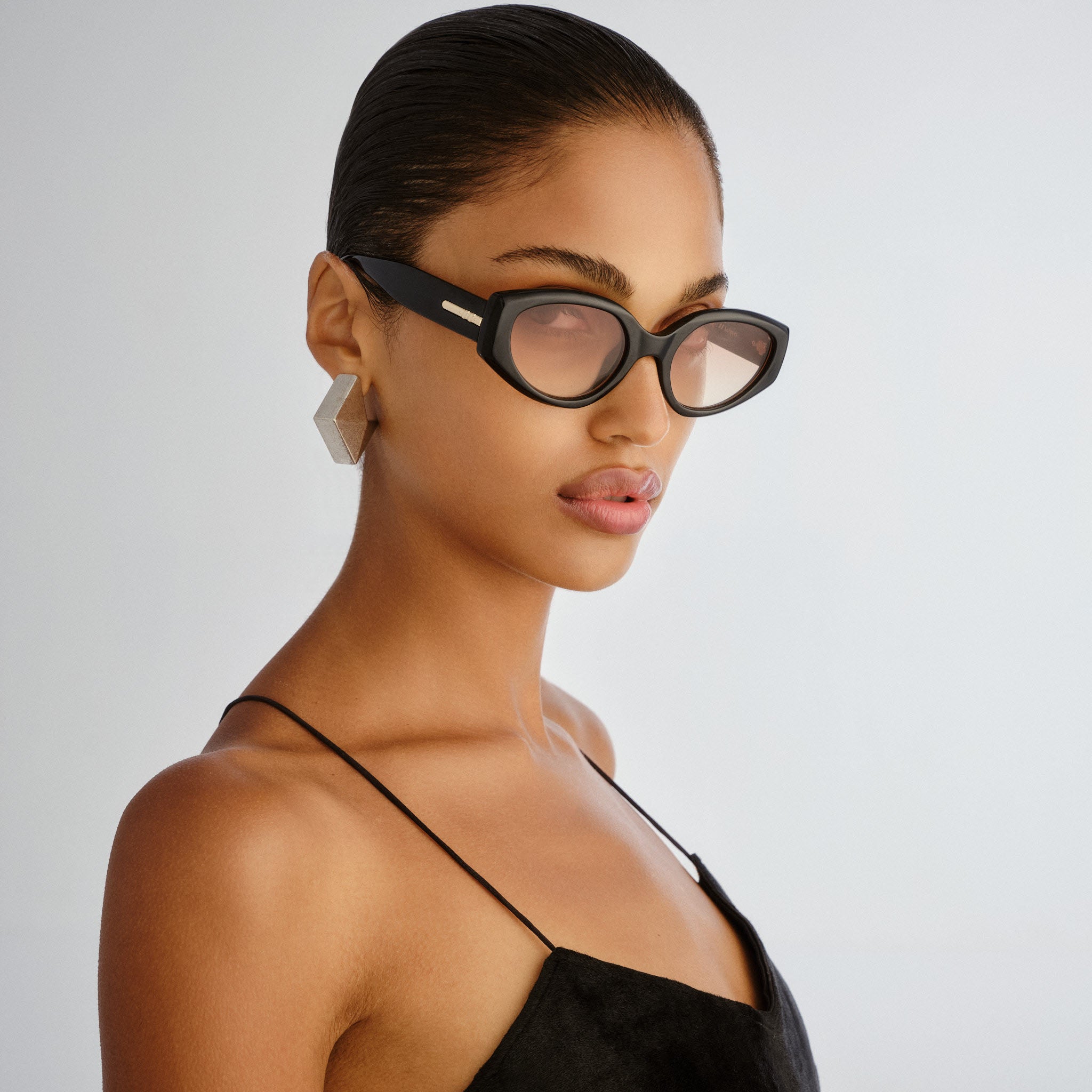 Le Specs Fevered + Black Female Oval Sunglasses | Eyewear Index