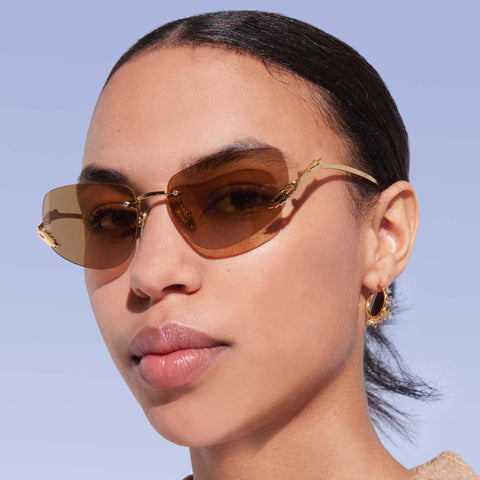 Karen Walker Fleur Dark Gold Female Wrap Sunglasses | Eyewear Index