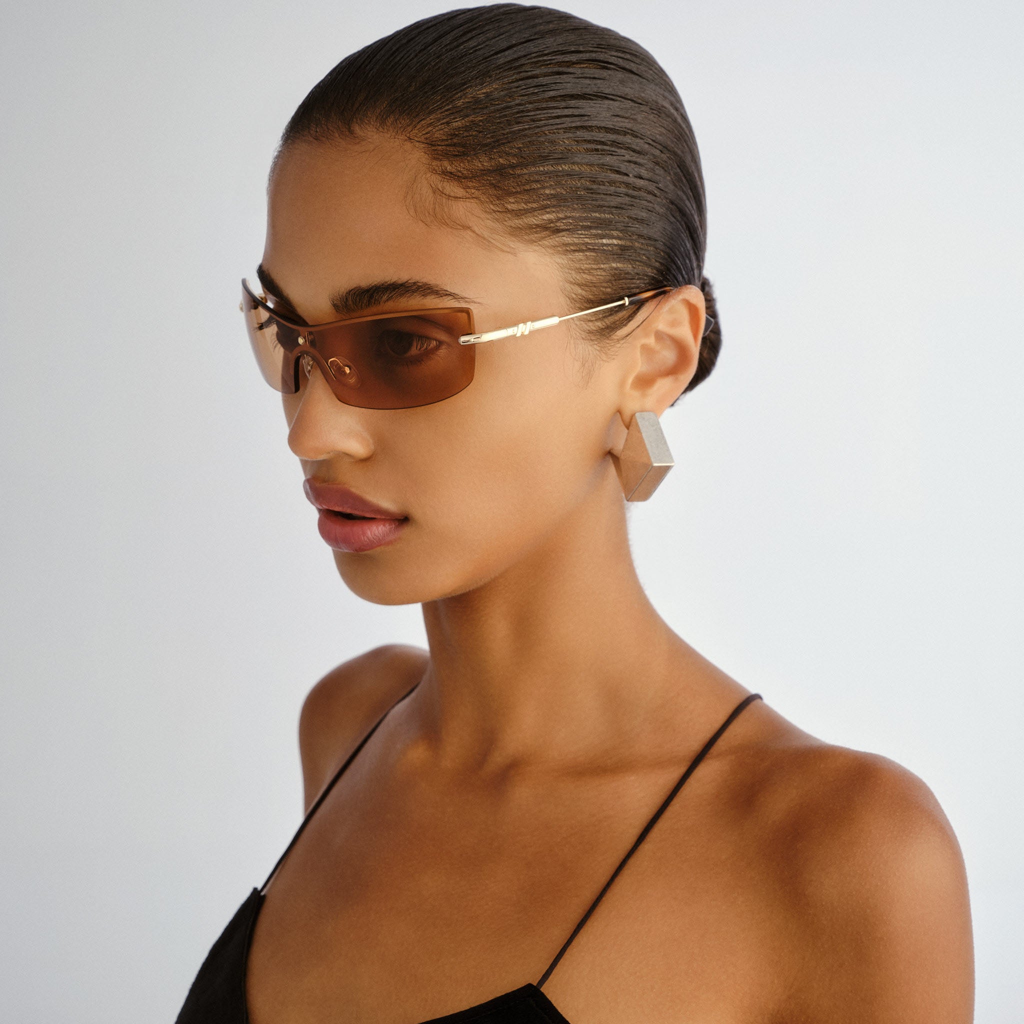 Le Specs Velvetine Gold Uni-Sex Wrap Sunglasses | Eyewear Index