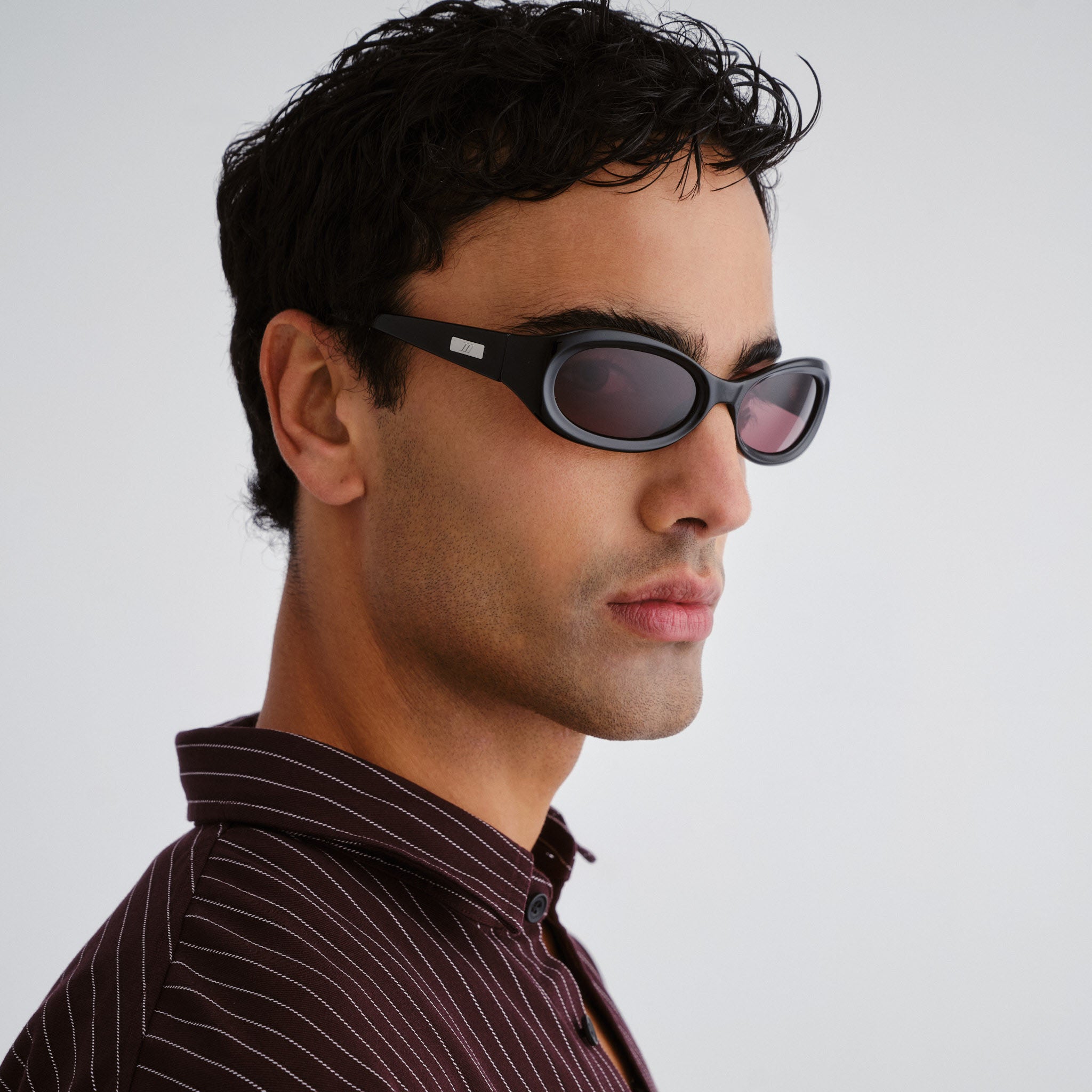 Le Specs Nightcrawler Black Uni-Sex Wrap Sunglasses | Eyewear Index