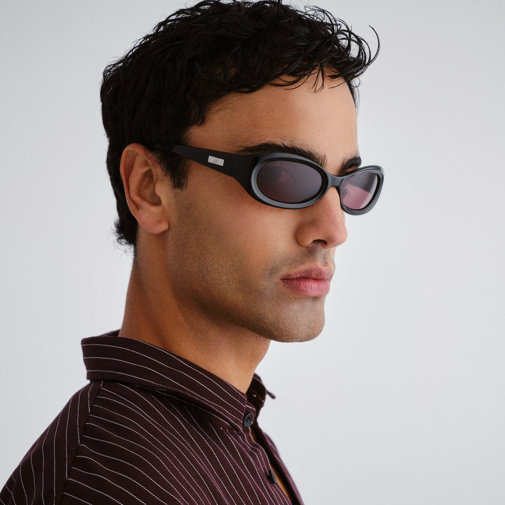 Le Specs Nightcrawler Black Uni-Sex Wrap Sunglasses | Eyewear Index