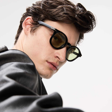 Le Specs Hoodwinked Black Uni-Sex Round Sunglasses | Eyewear Index