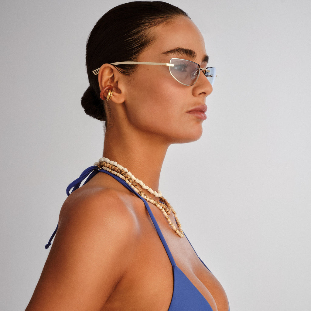 Le Specs Bubbles Gold Female Wrap Sunglasses | Eyewear Index