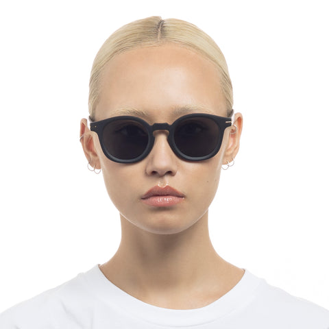 Le Specs Hoodwinked Matte Black Uni-Sex Round Sunglasses | Eyewear Index