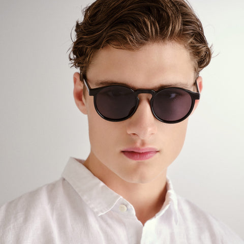 Le Specs Teen Spirit Deux Black Uni-Sex Round Sunglasses | Eyewear Index