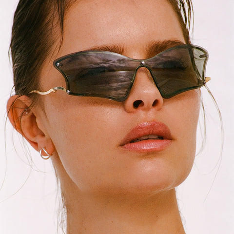 Le Specs Nymph Gold Female Wrap Sunglasses | Eyewear Index