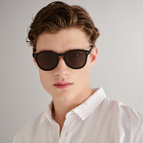 Le Specs Bandwagon Black Rubber Uni-Sex Round Sunglasses | Eyewear Index