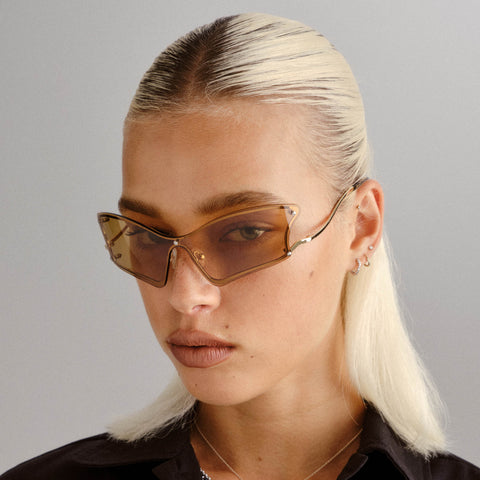 Le Specs Nymph Gold Female Wrap Sunglasses | Eyewear Index