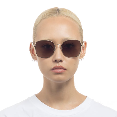 Le Specs Metamorphosis Gold Female Round Sunglasses | Eyewear Index