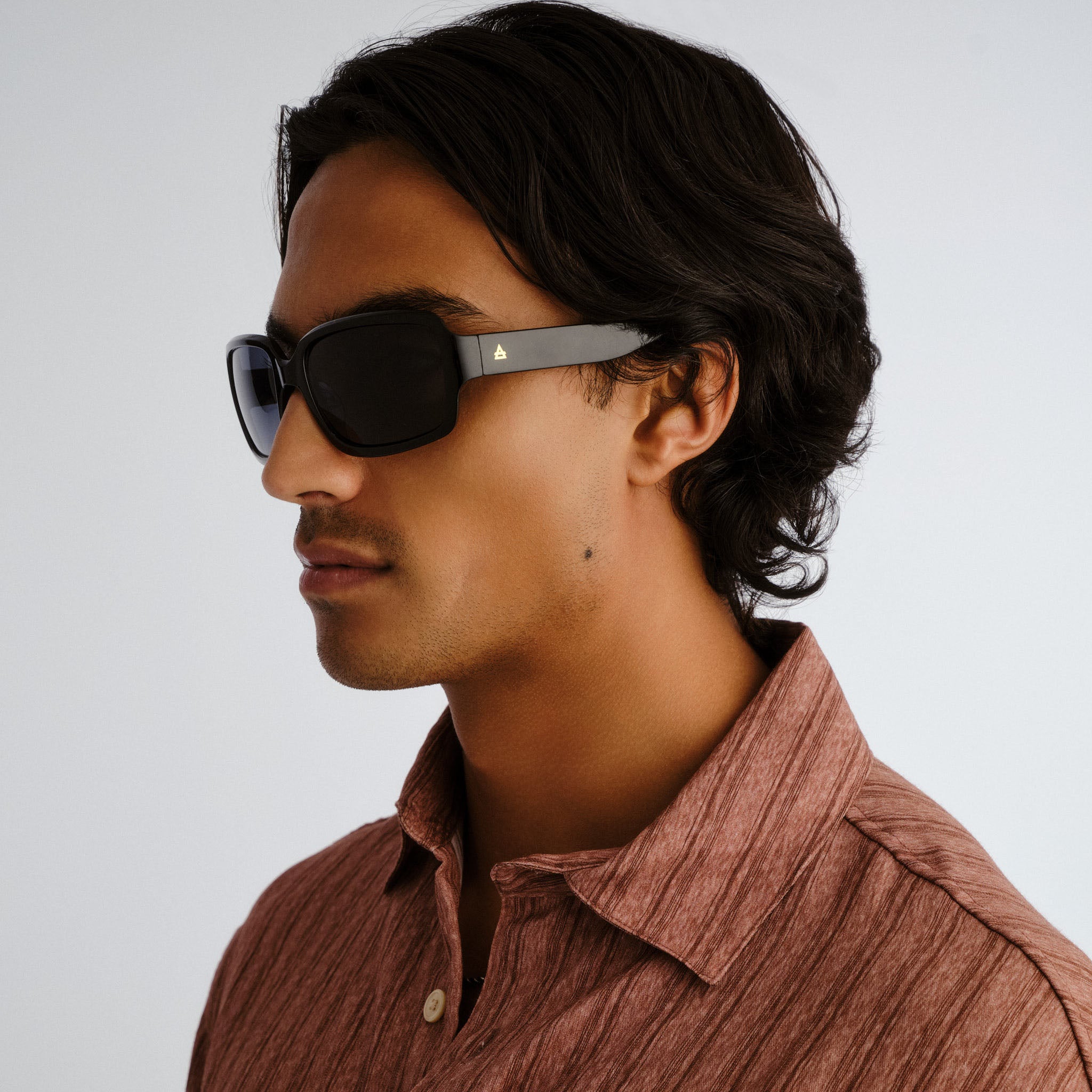 Aire Ignite Black Uni-Sex Wrap Sunglasses | Eyewear Index