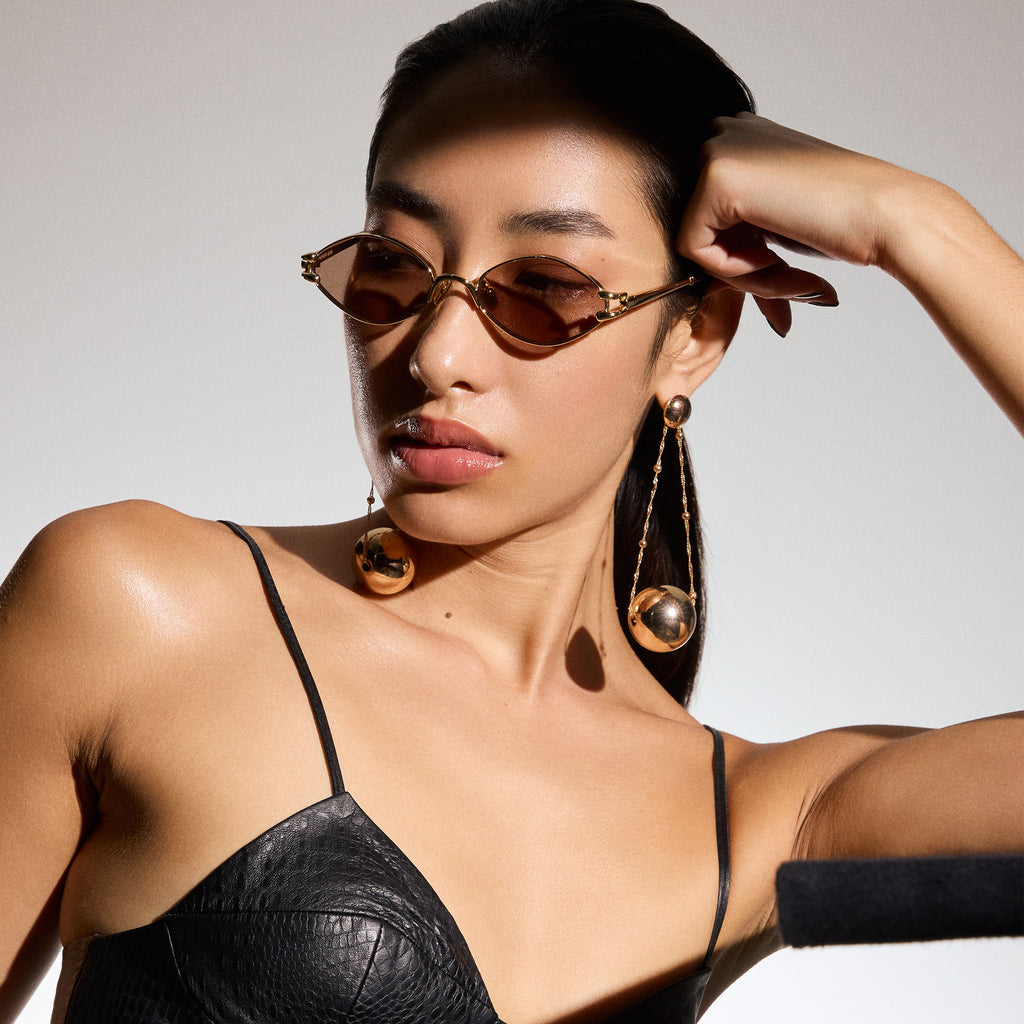 Le Specs Numero Quince Gold Female Oval Sunglasses | Eyewear Index