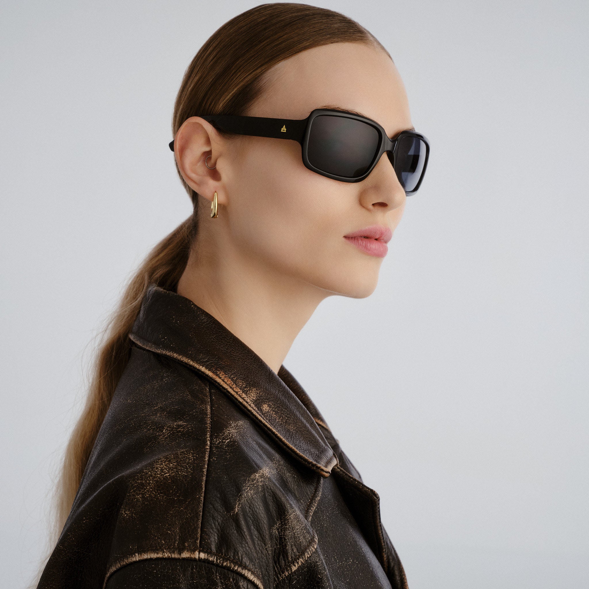 Aire Ignite Black Uni-Sex Wrap Sunglasses | Eyewear Index