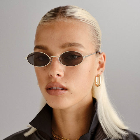 Le Specs Love Train Bright Gold Uni-Sex Oval Sunglasses | Eyewear Index